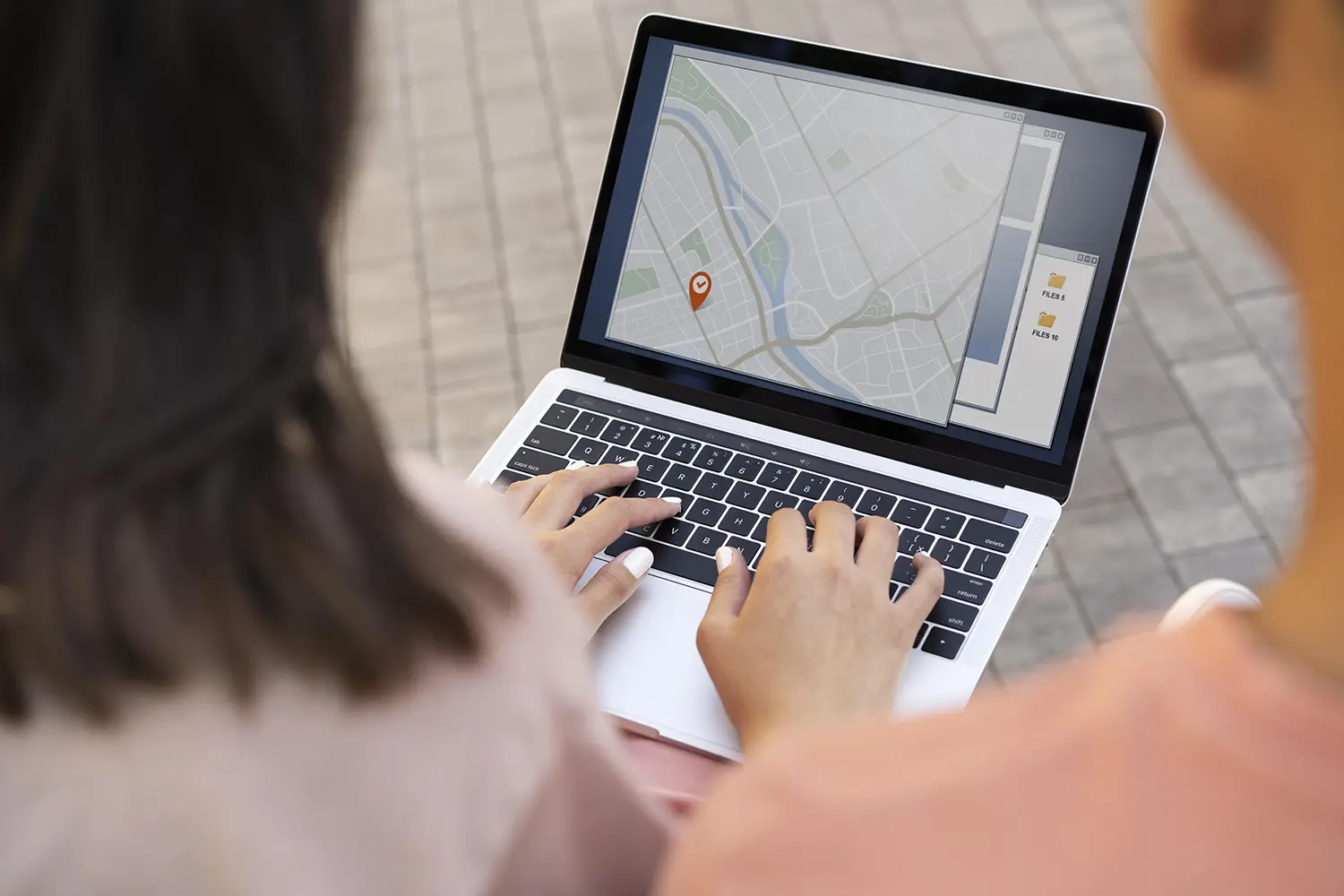 close up of woman tracking delivery on laptop