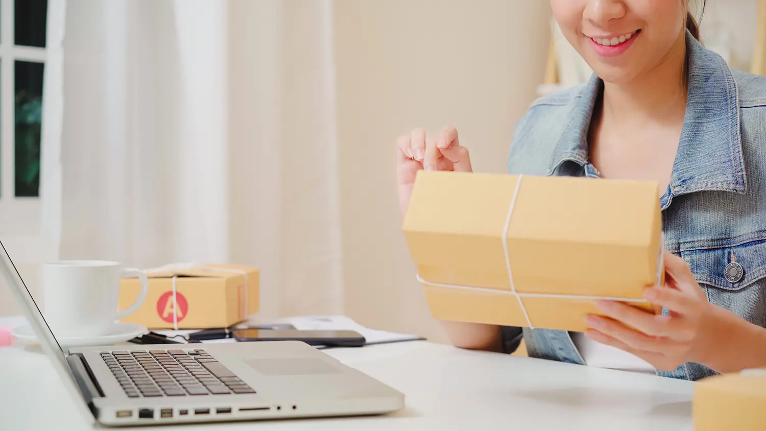 young entrepreneur checking parcel ready for delivery